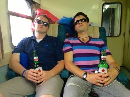 Matt and Aji reclining on the train, getting ready for our long journey.